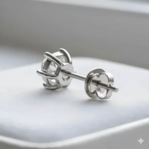 Secure screw-back closure and four-prong setting detail on the 18k white gold stud earring for added comfort and security.