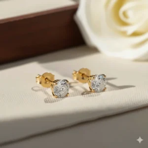 A stunning pair of minimalist round 18k yellow gold stud earrings featuring a strong screw back for babies or adults.