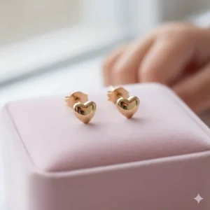 Dainty 14k gold heart stud earrings for girls, perfect for everyday wear.