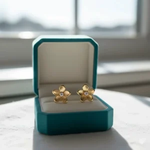 Delicate yellow 14k gold earrings for girls in a cute floral design.