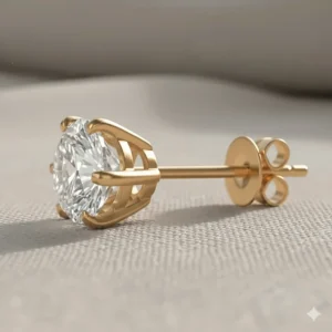 Side view of a single round brilliant diamond stud set in a four-prong 14k gold mounting, showcasing the security of the setting.