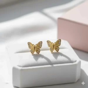 Pretty butterfly-shaped 14k gold earrings for girls with a subtle sparkle.
