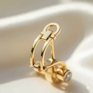 Detailed view of the secure security clasp on premium 18k gold earrings.