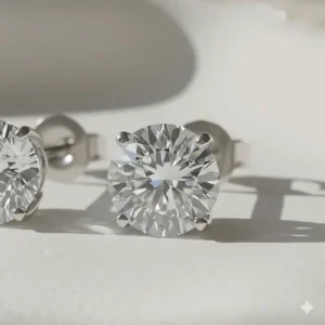 Extreme close-up of a brilliant-cut diamond stud showing the stone's fire and brilliance.