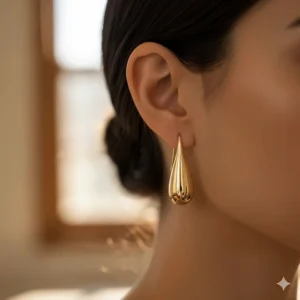 Luxurious teardrop 18k yellow gold dangle earrings with a polished finish.