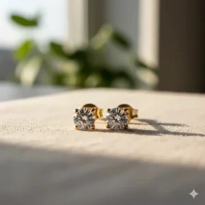 Dainty tiny 14k gold stud earrings featuring a brilliant, single cubic zirconia stone.