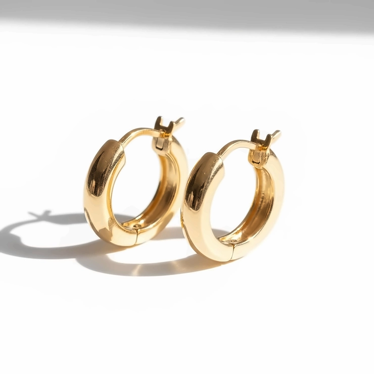 Stunning pair of 10 karat gold hoop earrings showcased on a white background, perfect for everyday wear.