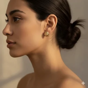 Profile view of a model wearing the 10k gold nugget stud earrings, showing their comfortable size and placement on the earlobe.
