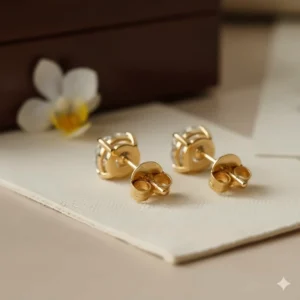 Close-up of secure 14k gold friction butterfly backings on diamond stud earrings.