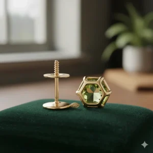 The secure gold screw-back closure and hallmark stamp on a pair of peridot earrings.