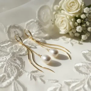 Elegant gold pearl drop earrings perfect for bridal jewelry or formal occasions.