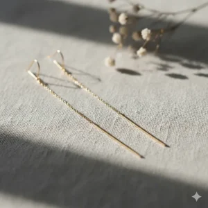 Minimalist long gold threader drop earrings for a sleek and modern look.
