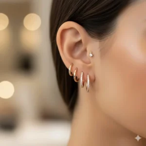 A woman wearing rose gold diamond huggie earrings for an elegant everyday look.