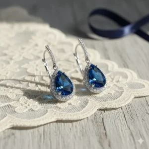 Sapphire blue crystal teardrop earrings for wedding something blue tradition in a teardrop shape.