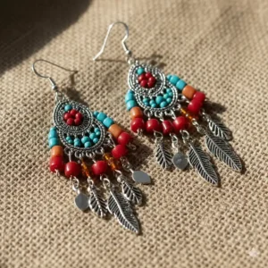 Vibrant boho-style beaded long dangle earrings for women featuring turquoise and red accents.