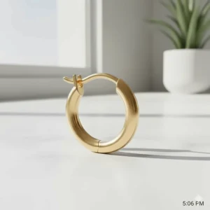 Illustration showing the secure hinge and click-clasp closure of a huggie hoop earring.