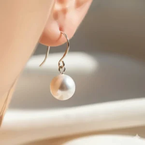 Classic white freshwater pearl drop earrings for women with sterling silver hooks.
