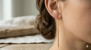 Close-up view of the polished finish on a vertical long bar threader earring.