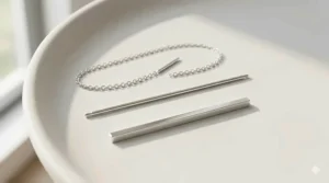 High-resolution product illustration of minimalist sterling silver bar threader earrings, showcasing the polished finish and delicate design.