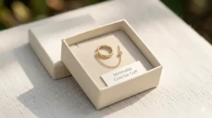 Dainty ear cuff with chain displayed in a sustainable jewelry gift box.