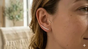 Pair of handcrafted sterling silver bar ear climbers with a high-polish finish on a white background.